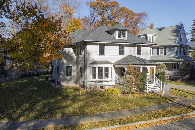 view of front of house featuring a porch and a front yard