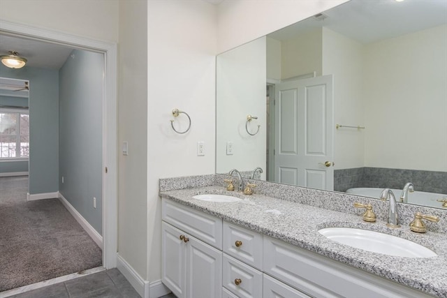 bathroom featuring tile patterned flooring and vanity