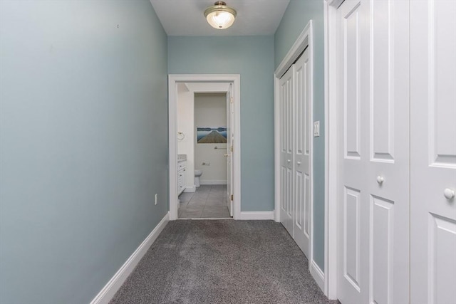 hallway featuring carpet