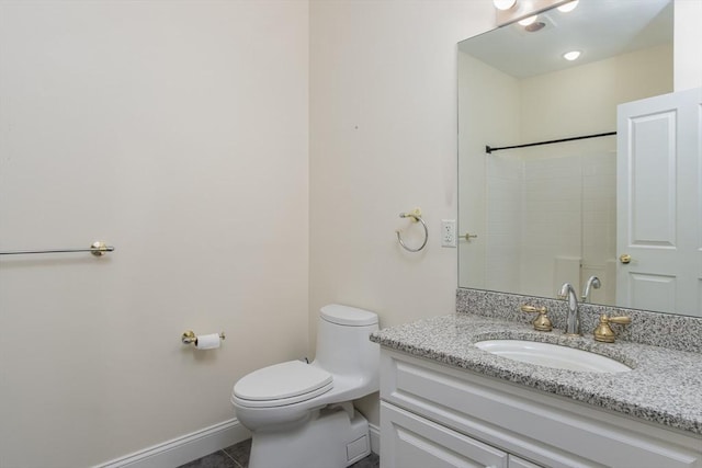 bathroom featuring vanity, tile patterned flooring, a shower, and toilet