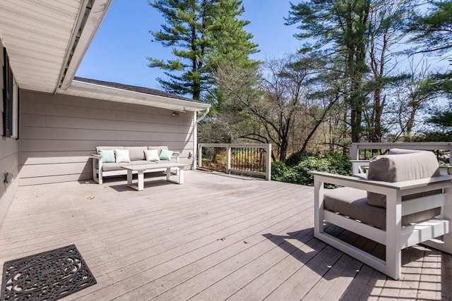 wooden deck with an outdoor hangout area