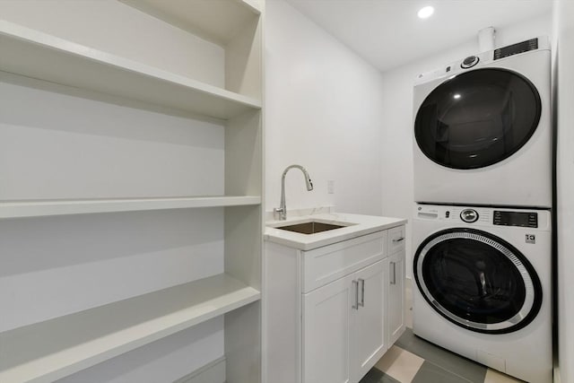 87 Dorchester St, Quincy, MA 02171 - laundry room featuring stacked washer and clothes dryer, cabinet space, recessed lighting, and light tile patterned floors