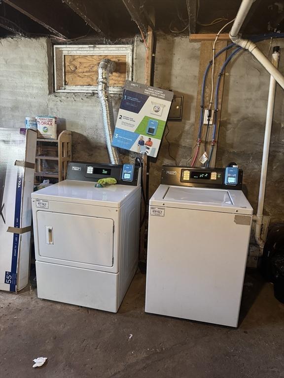 laundry room featuring washing machine and clothes dryer