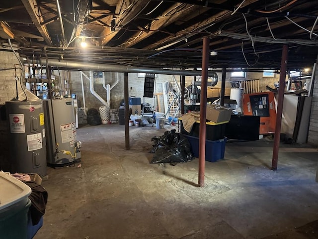 basement featuring electric water heater and water heater