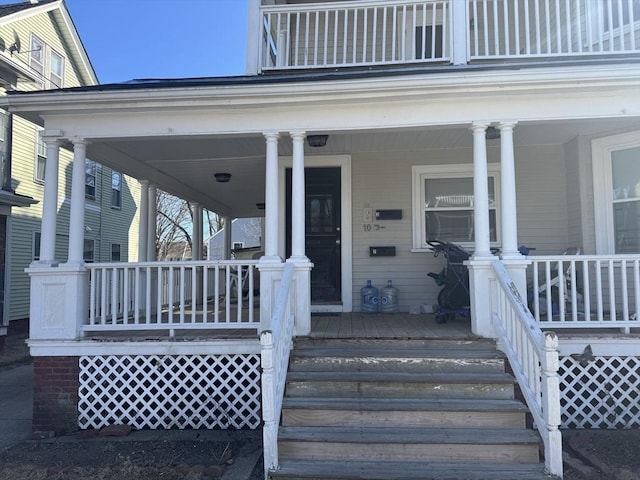 view of exterior entry featuring a porch