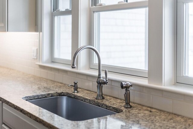 15 Hydrangea Cir, Falmouth, MA 02536 - kitchen view of a sink, tasteful backsplash, and light stone counters