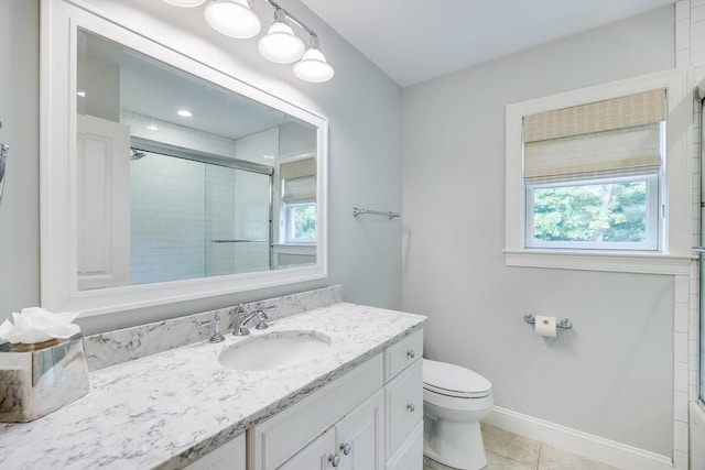 15 Hydrangea Cir, Falmouth, MA 02536 - bathroom with vanity, a shower with door, toilet, tile patterned flooring, and baseboards