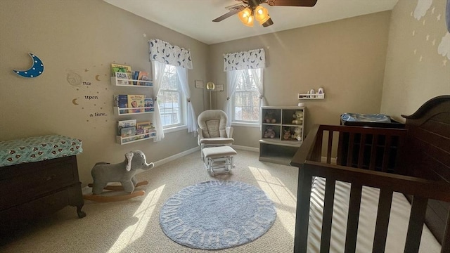 bedroom with a ceiling fan, baseboards, and carpet floors