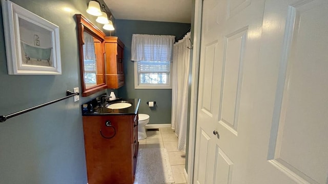 full bathroom with vanity, baseboards, visible vents, tile patterned flooring, and toilet