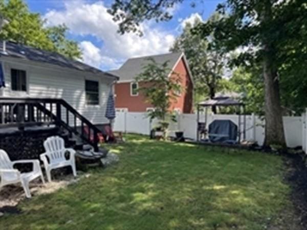 view of yard with a gazebo and a deck