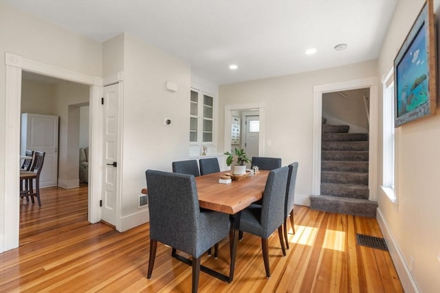 13 Darling St, Acushnet, MA 02743 - dining space with light wood-style floors, stairs, baseboards, and recessed lighting