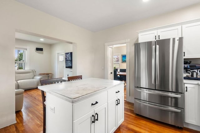 13 Darling St, Acushnet, MA 02743 - kitchen with freestanding refrigerator, light wood-style floors, light countertops, white cabinets, and recessed lighting