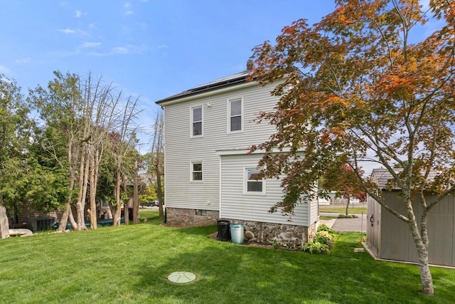 13 Darling St, Acushnet, MA 02743 - rear view of property featuring a yard and solar panels