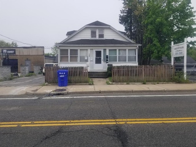 1166 Douglas Ave, North Providence, RI 02904 - view of front facade with a fenced front yard