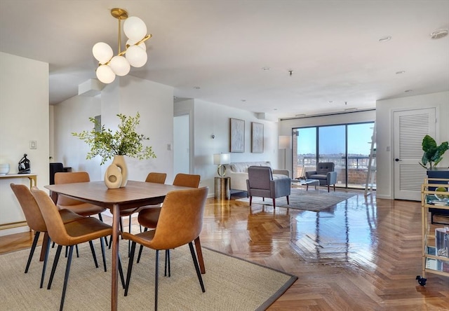 dining space featuring a notable chandelier