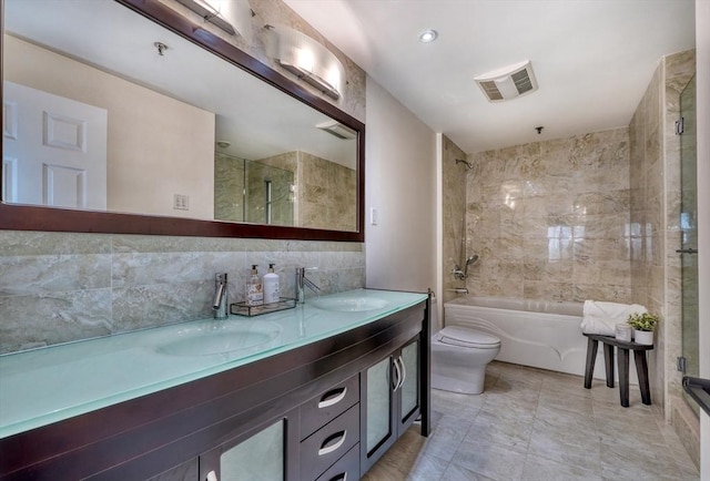 full bathroom featuring toilet, visible vents, a sink, and shower / bathing tub combination