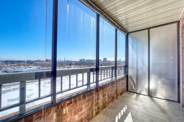 unfurnished sunroom with a view of city