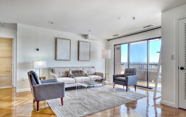 living room with visible vents and baseboards