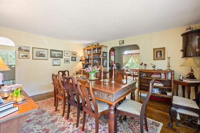 63 Hawthorne, Weymouth, MA 02189 - dining space featuring arched walkways, wood finished floors, and baseboards