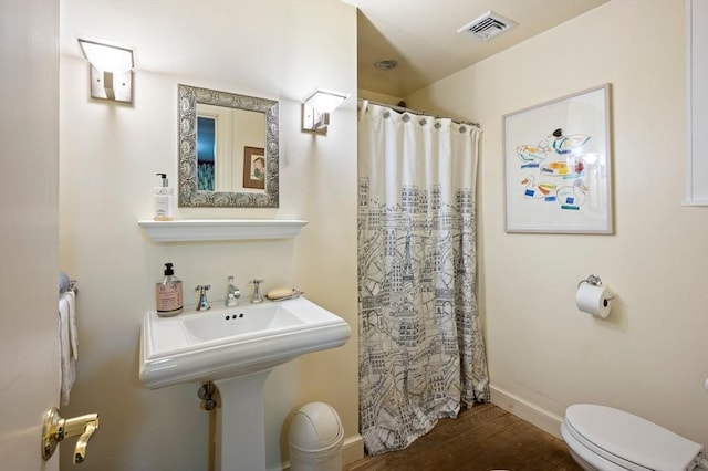 63 Hawthorne, Weymouth, MA 02189 - full bath with toilet, wood finished floors, a shower with curtain, and baseboards