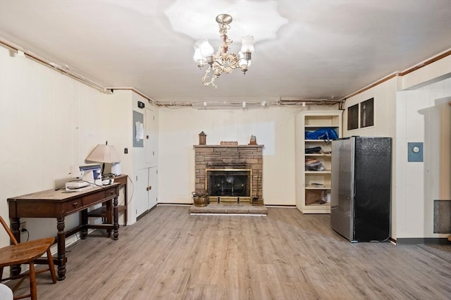63 Hawthorne, Weymouth, MA 02189 - living area with wood finished floors, a fireplace, and a chandelier
