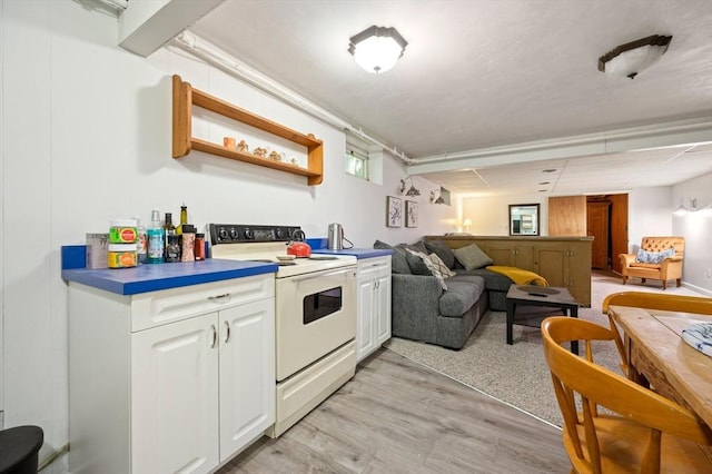 63 Hawthorne, Weymouth, MA 02189 - kitchen featuring white electric range oven, open floor plan, white cabinetry, light wood-style floors, and open shelves