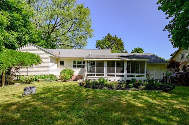 63 Hawthorne, Weymouth, MA 02189 - rear view of house with a sunroom and a lawn
