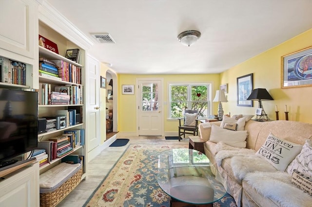63 Hawthorne, Weymouth, MA 02189 - living room featuring arched walkways and light wood-style flooring