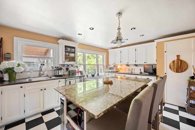 63 Hawthorne, Weymouth, MA 02189 - kitchen featuring light flooring, a sink, backsplash, a kitchen island, and recessed lighting