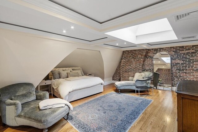 178 Commonwealth Unit 7, Boston, MA 02116 - bedroom with crown molding, brick wall, baseboards, wood finished floors, and visible vents