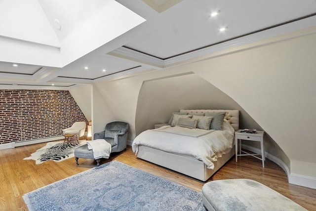 bedroom with ornamental molding, wood finished floors, baseboards, a baseboard heating unit, and coffered ceiling