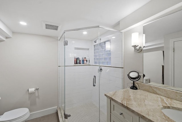 full bathroom with visible vents, vanity, toilet, tile patterned floors, and a stall shower