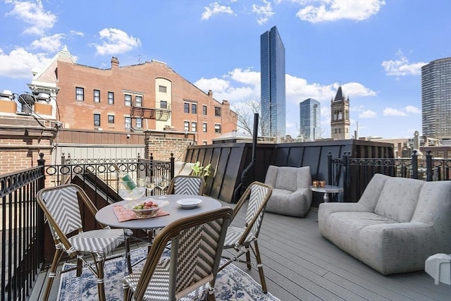 deck featuring outdoor dining area