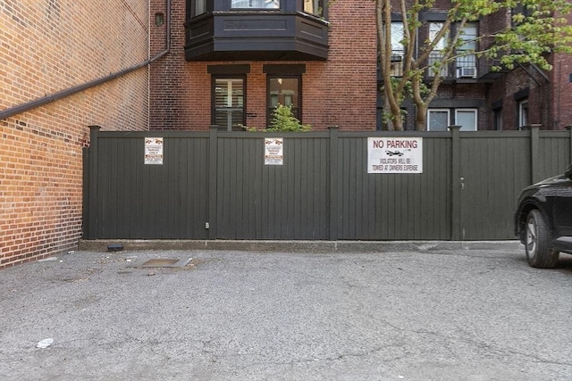 view of gate with fence