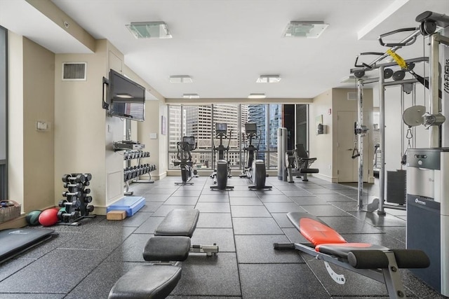 gym featuring floor to ceiling windows