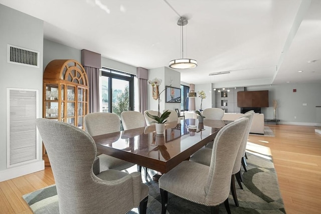 dining room with light hardwood / wood-style flooring