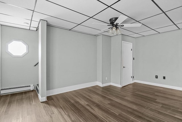 160 Stewart St, Fall River, MA 02720 - spare room with baseboard heating, a drop ceiling, a ceiling fan, and wood finished floors