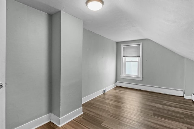 160 Stewart St, Fall River, MA 02720 - additional living space with a baseboard radiator, vaulted ceiling, and wood finished floors
