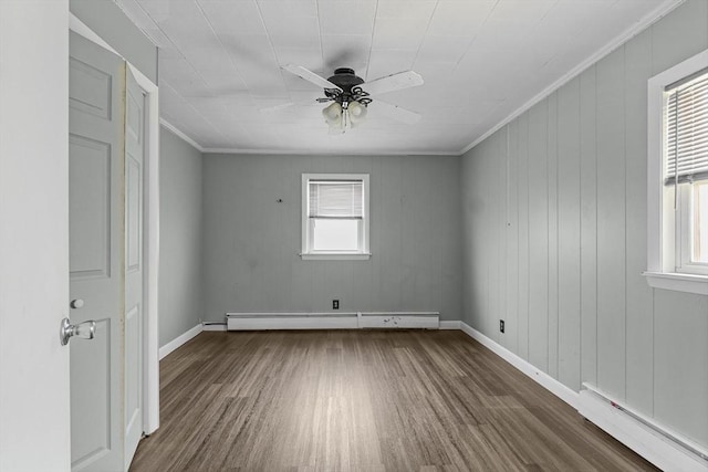 160 Stewart St, Fall River, MA 02720 - spare room with a baseboard radiator, wood finished floors, a ceiling fan, and ornamental molding