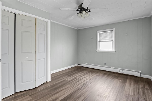 160 Stewart St, Fall River, MA 02720 - unfurnished bedroom featuring a baseboard radiator, crown molding, dark wood-style flooring, a closet, and a ceiling fan