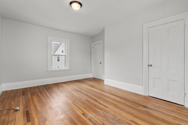117 Babson St, Boston, MA 02126 - unfurnished bedroom featuring baseboards and light wood-style flooring