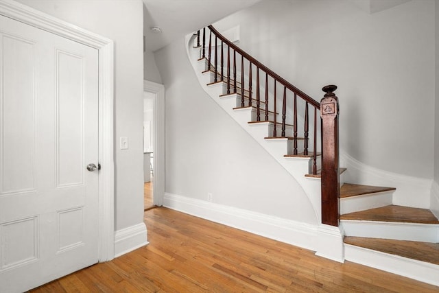 117 Babson St, Boston, MA 02126 - staircase with wood finished floors and baseboards