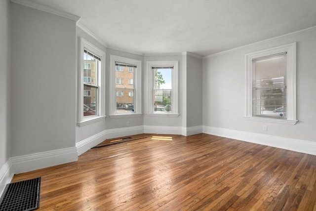 117 Babson St, Boston, MA 02126 - spare room featuring hardwood / wood-style floors and crown molding