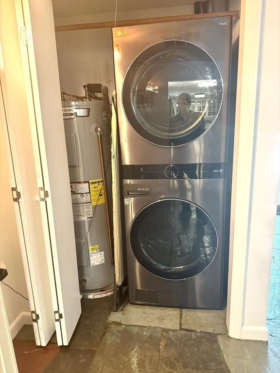 51 Karen Rd, Framingham, MA 01701 - laundry area with stacked washer / drying machine and electric water heater