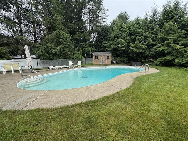 51 Karen Rd, Framingham, MA 01701 - view of pool featuring a storage shed, a patio, and view of scattered trees