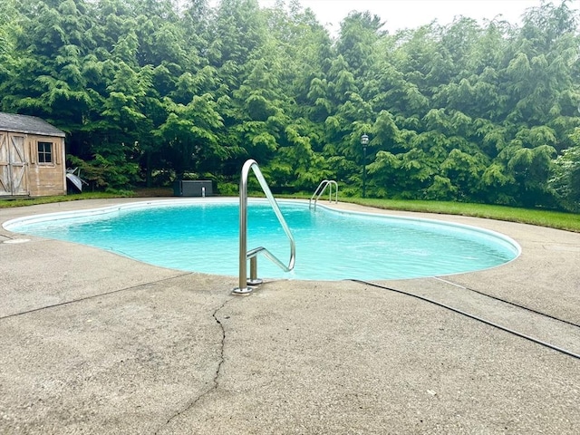 51 Karen Rd, Framingham, MA 01701 - swimming pool featuring a storage unit and a patio area