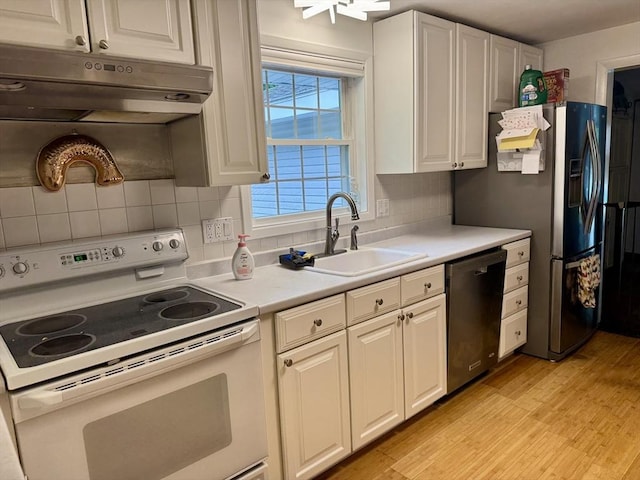51 Karen Rd, Framingham, MA 01701 - kitchen featuring appliances with stainless steel finishes, under cabinet range hood, light wood-type flooring, and light countertops