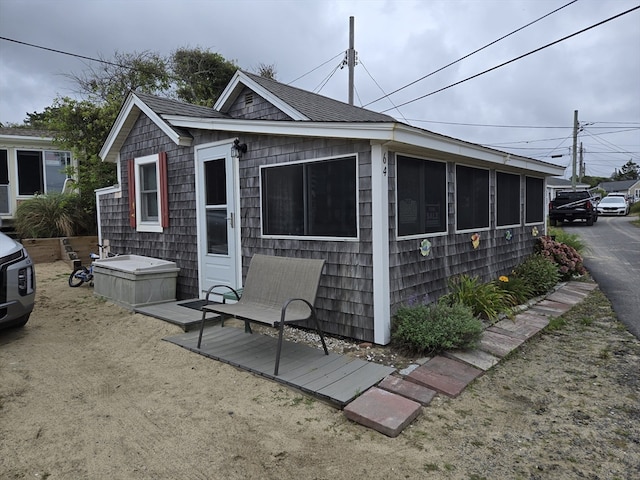 exterior space featuring a sunroom