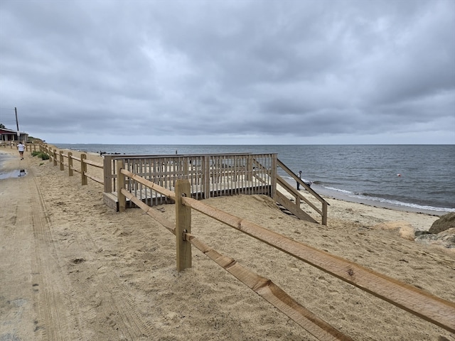 view of property's community featuring a view of the beach and a water view