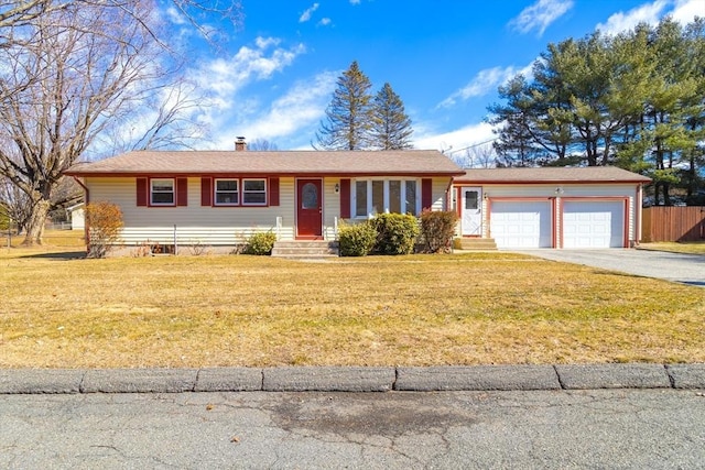 ranch-style home with driveway, fence, a front yard, an attached garage, and a chimney